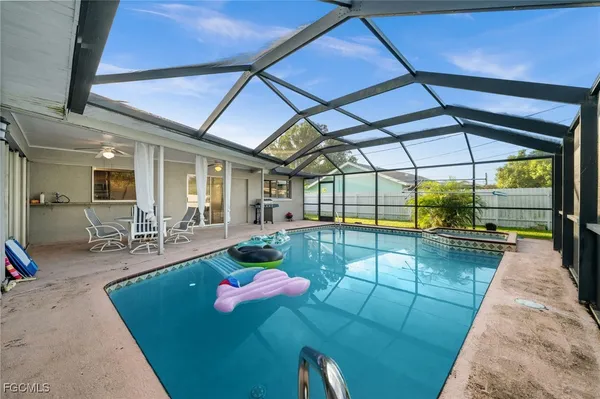 a view of a swimming pool with a patio