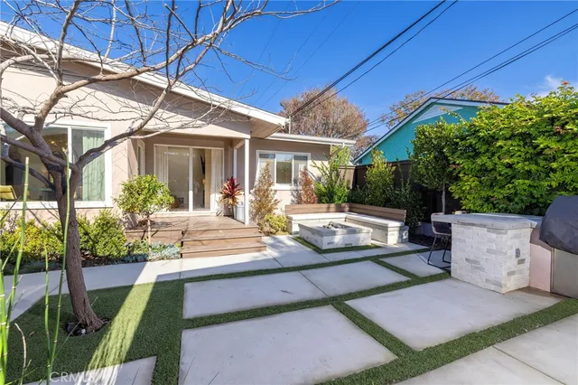 a view of a patio with table and chairs and potted plants