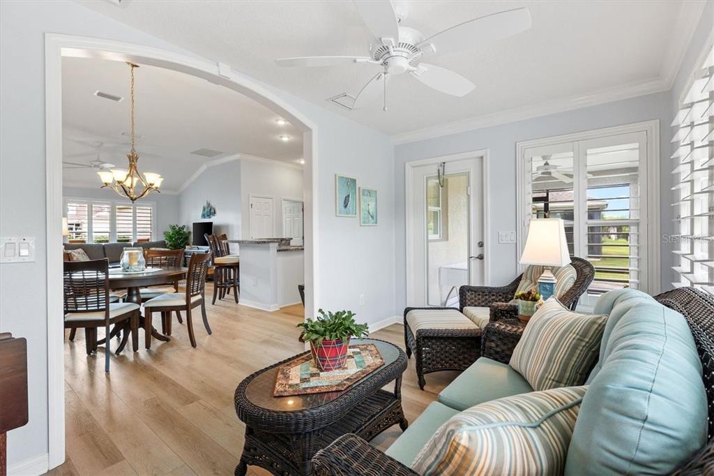3394 Ridgewood Path The Villages, FL 32163 - Photo 11 of 30 a living room with furniture kitchen and a chandelier