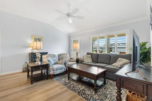 a living room with furniture and a large window
