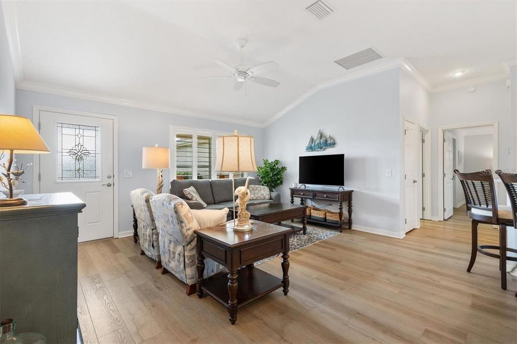 3394 Ridgewood Path The Villages, FL 32163 - Photo 13 of 30 a living room with furniture and a flat screen tv