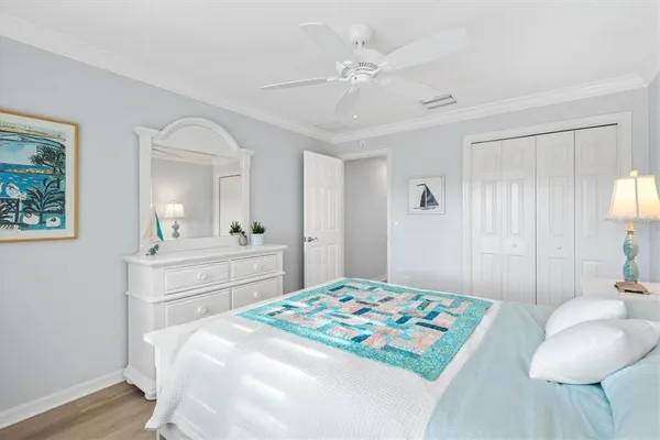 a bedroom with a bed and a chair