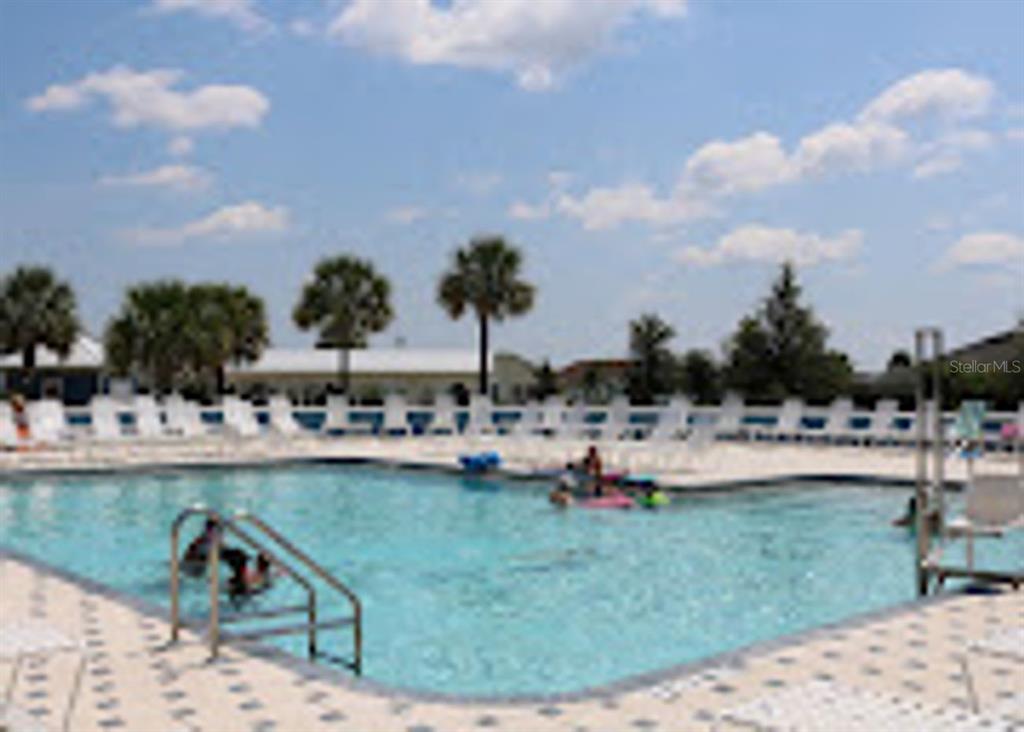 3394 Ridgewood Path The Villages, FL 32163 - Photo 29 of 30 a view of a swimming pool and lounge chair