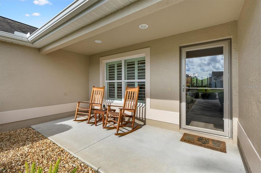 3394 Ridgewood Path The Villages, FL 32163 - Photo 3 of 30 a view of a chairs and table in a room