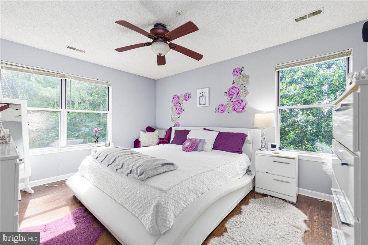 14018 Valleyfield Drive, Unit 8 Silver Spring, MD 20906 - Photo 16 of 20 a bedroom with a large bed and a large window