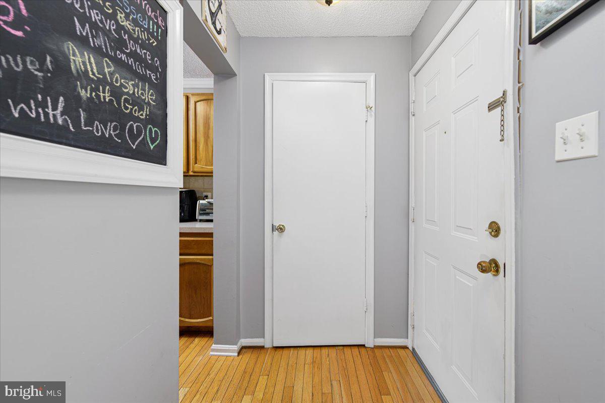 14018 Valleyfield Drive, Unit 8 Silver Spring, MD 20906 - Photo 3 of 20 a view of front door with wooden floor