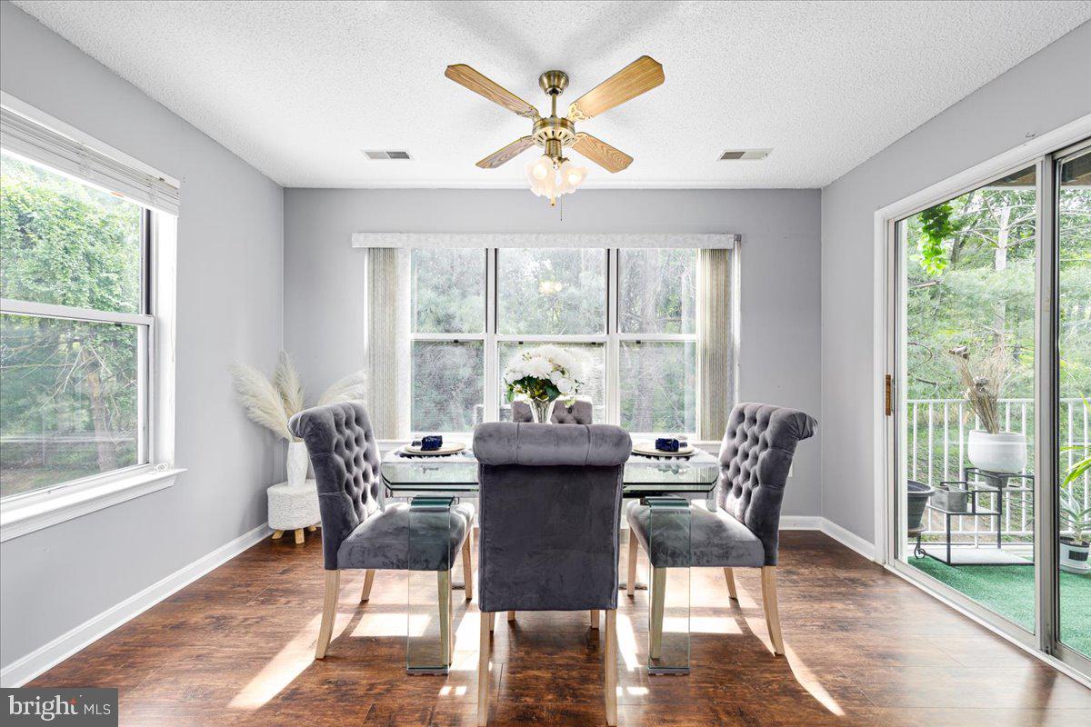 14018 Valleyfield Drive, Unit 8 Silver Spring, MD 20906 - Photo 8 of 20 a dining room with furniture window and wooden floor