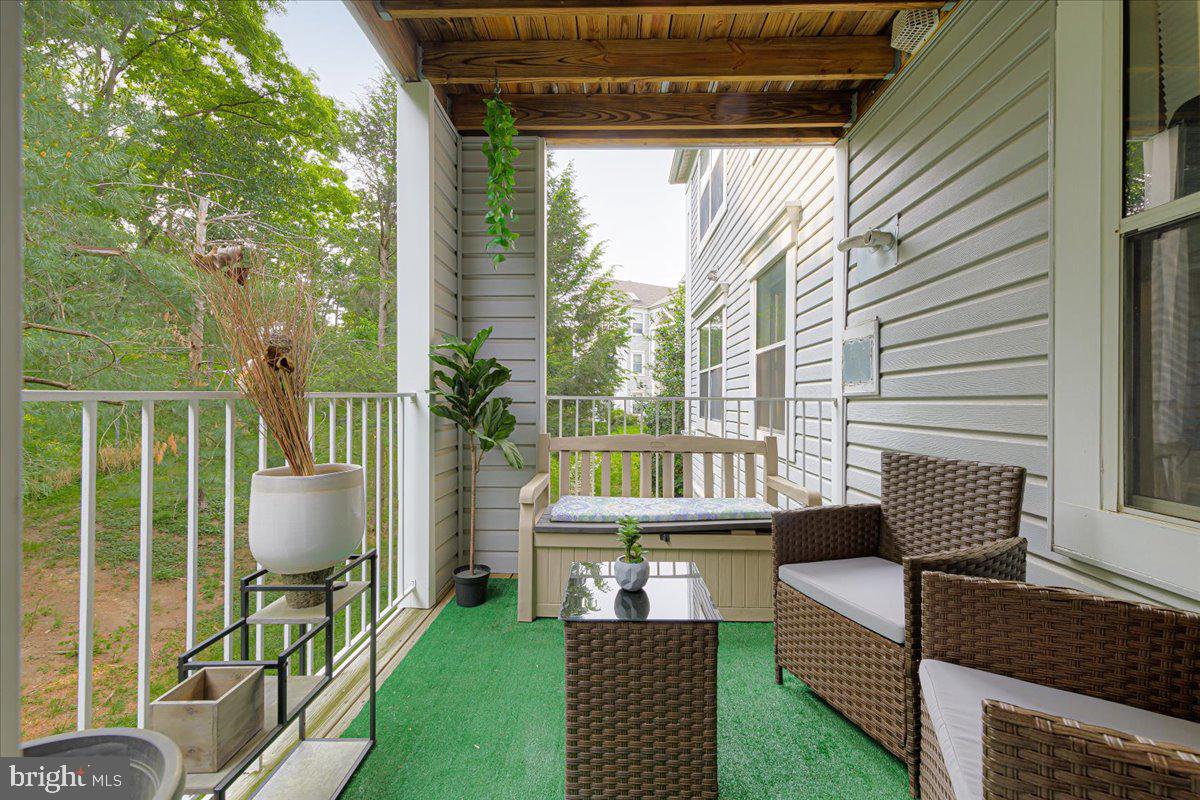 14018 Valleyfield Drive, Unit 8 Silver Spring, MD 20906 - Photo 9 of 20 a outdoor living space with furniture and garden view