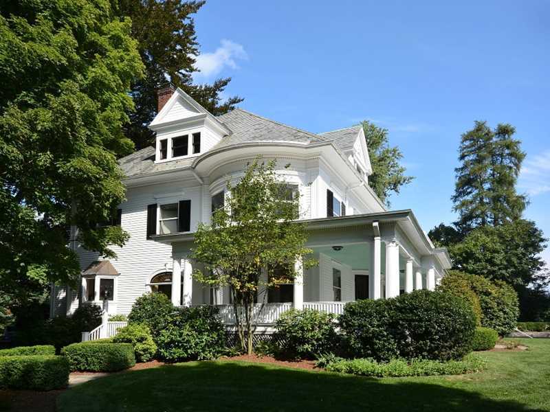 66 Pear Tree Point Road Darien, CT 06820 - Photo 1 of 25 a front view of a house with a yard