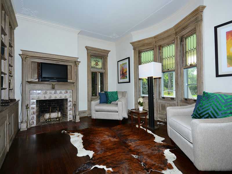 66 Pear Tree Point Road Darien, CT 06820 - Photo 13 of 25 a living room with furniture and a fireplace