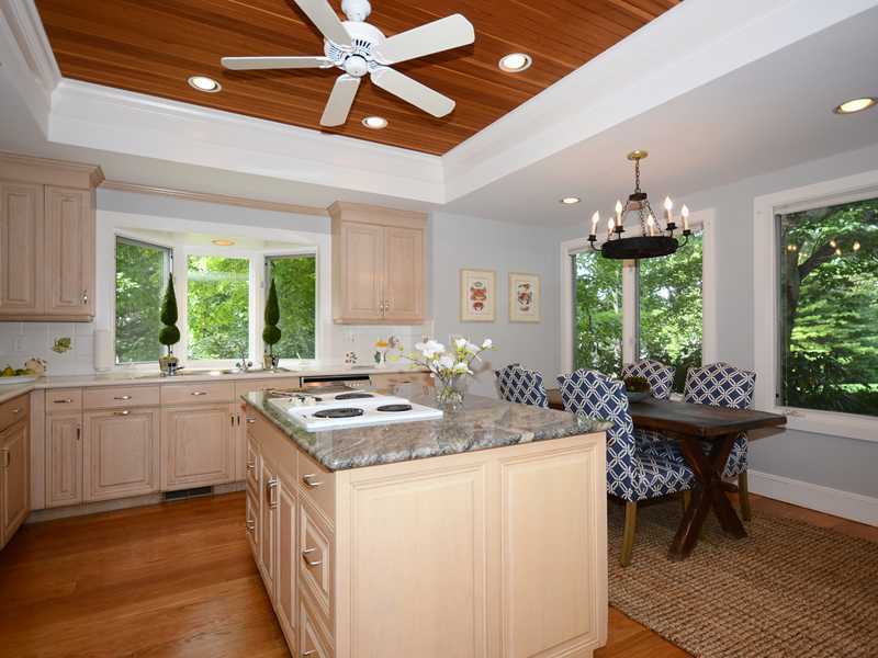 66 Pear Tree Point Road Darien, CT 06820 - Photo 14 of 25 a kitchen with a sink stove and cabinets