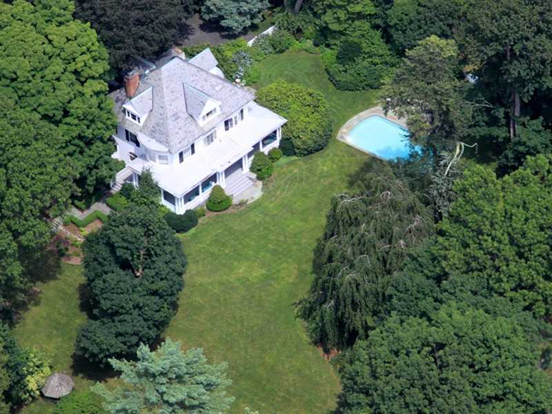 66 Pear Tree Point Road Darien, CT 06820 - Photo 4 of 25 an aerial view of a house with a yard