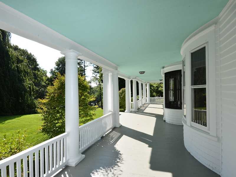 66 Pear Tree Point Road Darien, CT 06820 - Photo 6 of 25 a view of a porch with furniture and garden