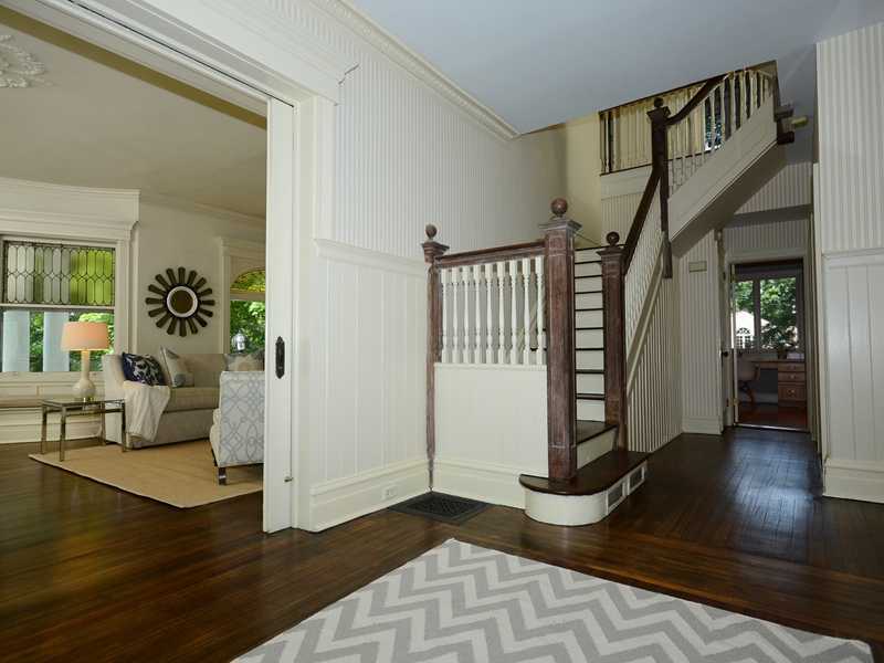 66 Pear Tree Point Road Darien, CT 06820 - Photo 9 of 25 a view of an entryway with wooden floor and a livingroom