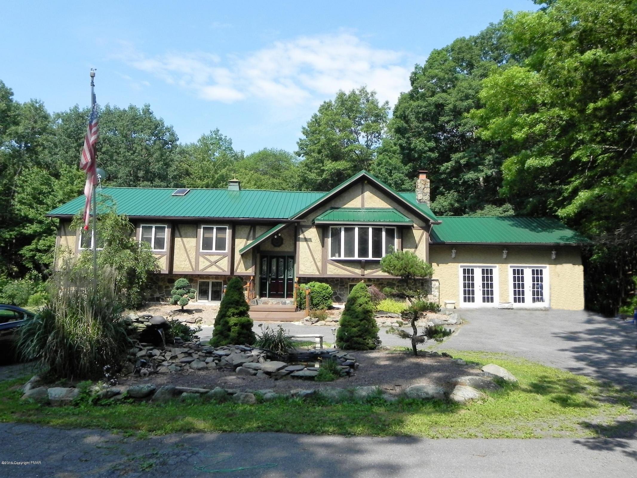 141 Rinker Road Stroudsburg, PA 18360 - Photo 1 of 29 a front view of a house with a yard