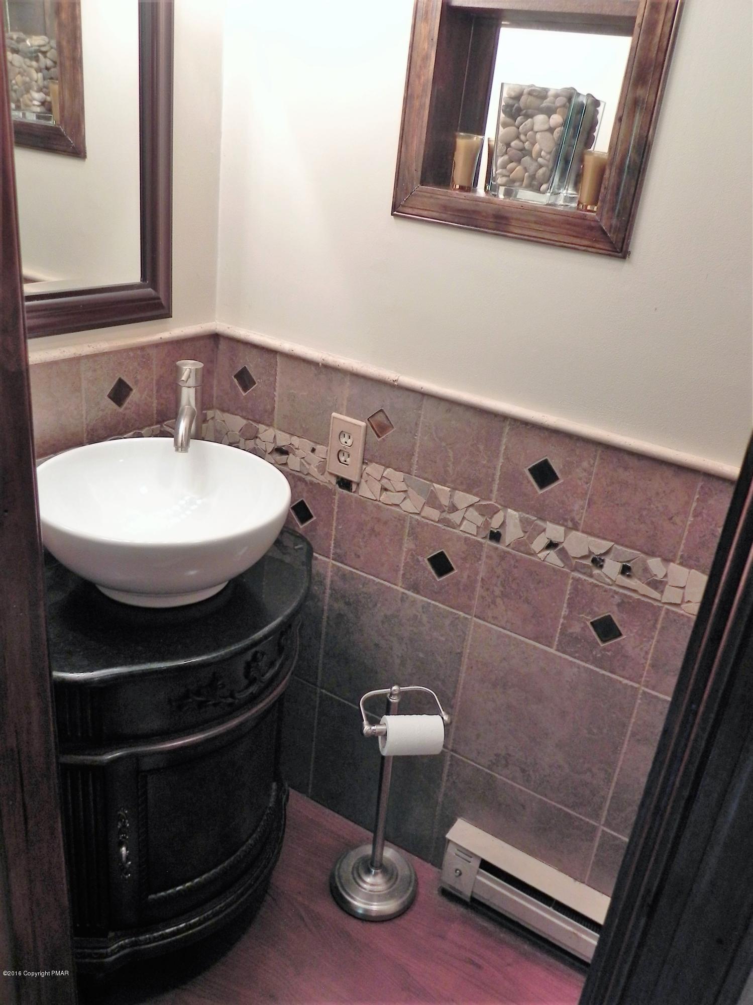141 Rinker Road Stroudsburg, PA 18360 - Photo 14 of 29 a bathroom with a sink and a mirror