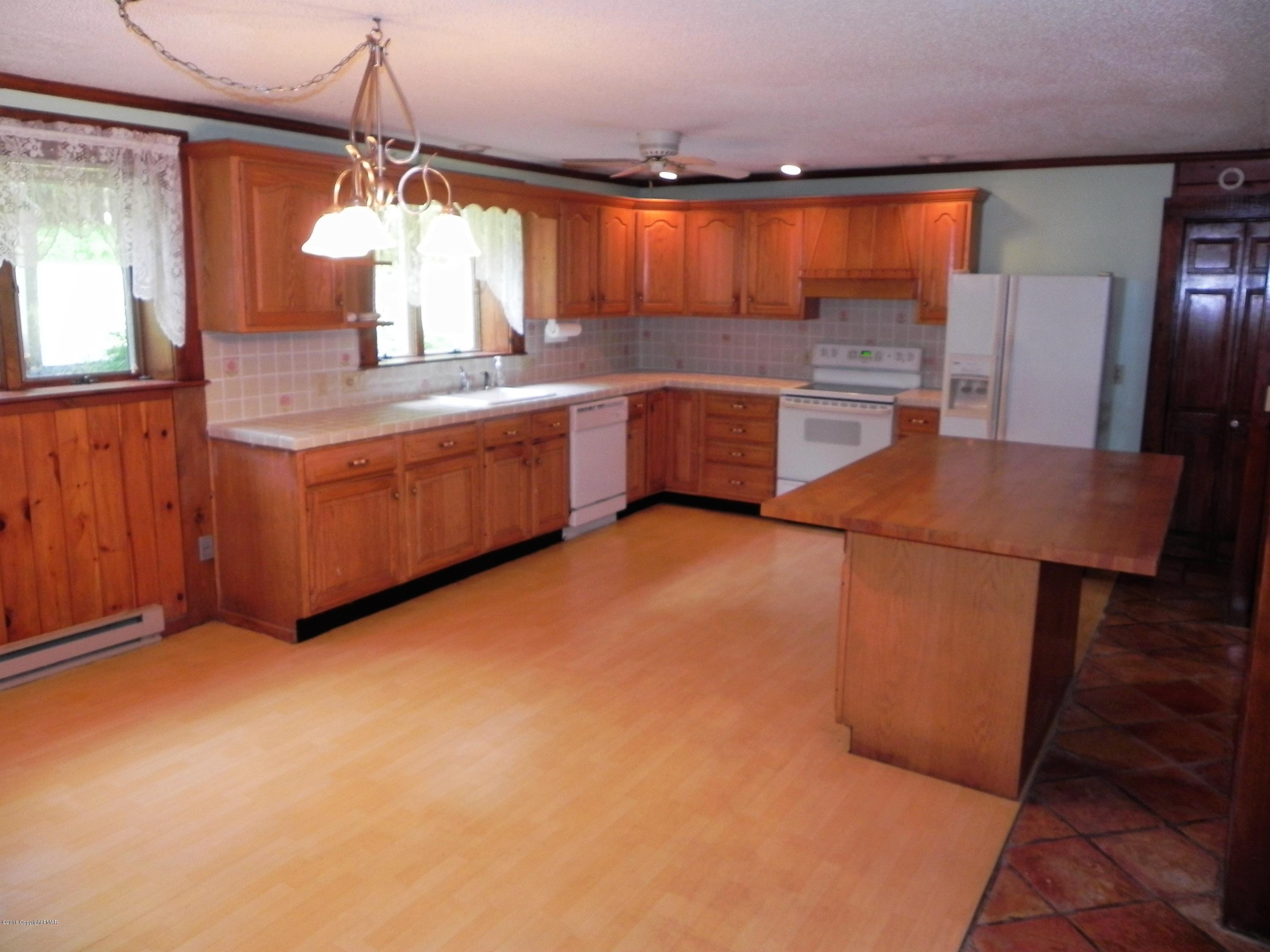 141 Rinker Road Stroudsburg, PA 18360 - Photo 17 of 29 a kitchen with stainless steel appliances granite countertop a sink counter space cabinets and a window