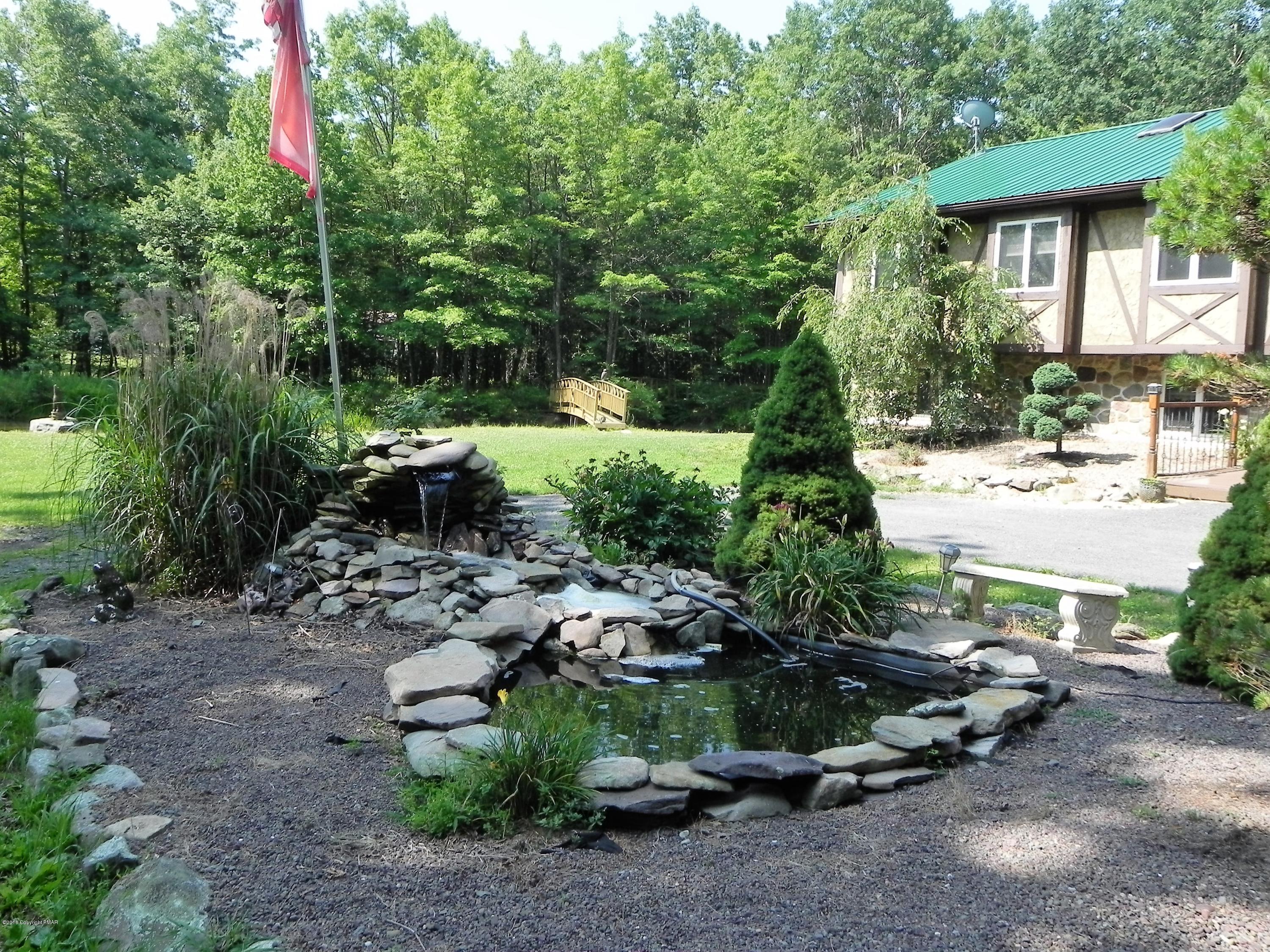 141 Rinker Road Stroudsburg, PA 18360 - Photo 2 of 29 a backyard of a house with a yard and outdoor seating