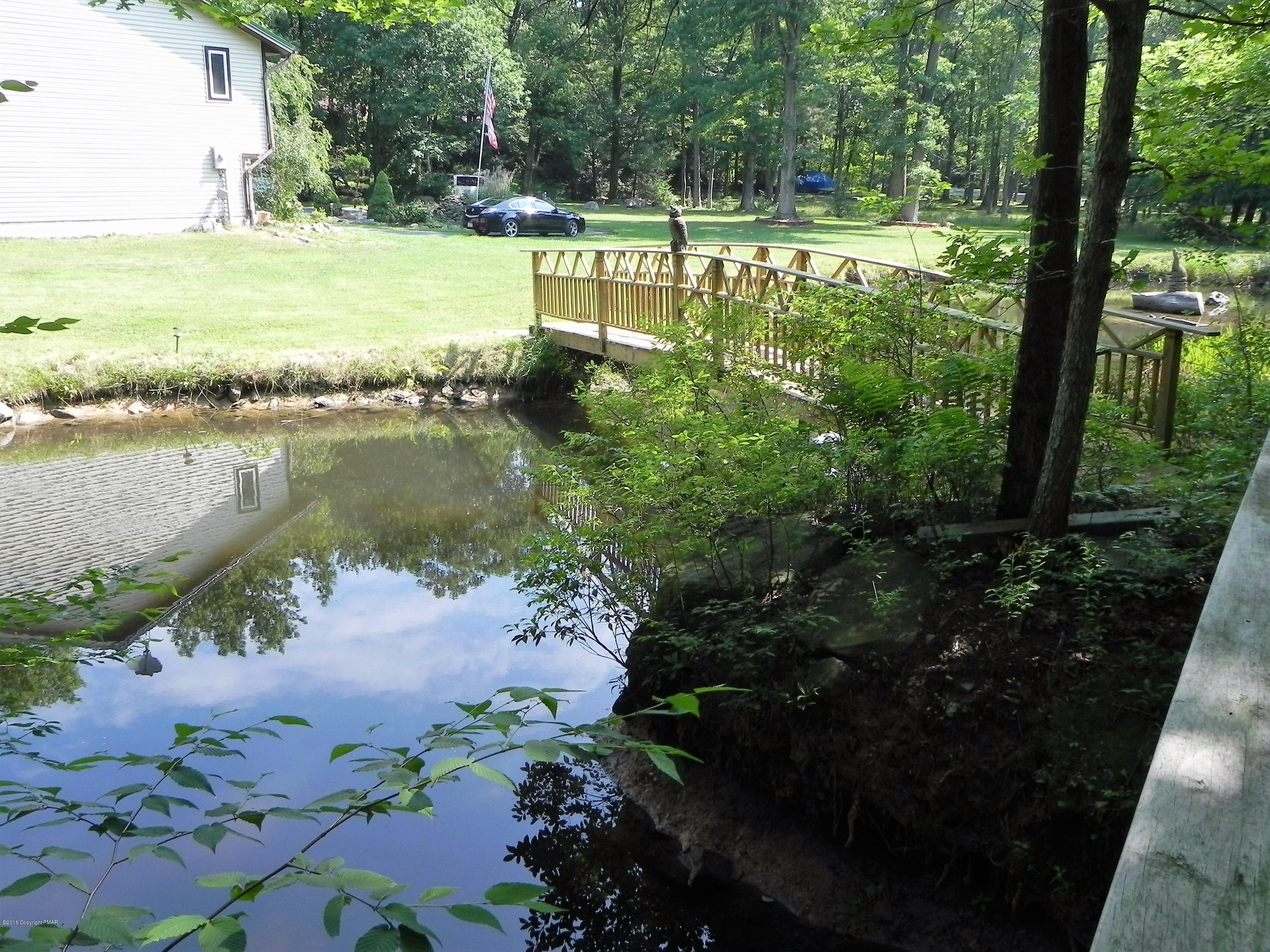 141 Rinker Road Stroudsburg, PA 18360 - Photo 27 of 29 a view of a lake with a house in the background