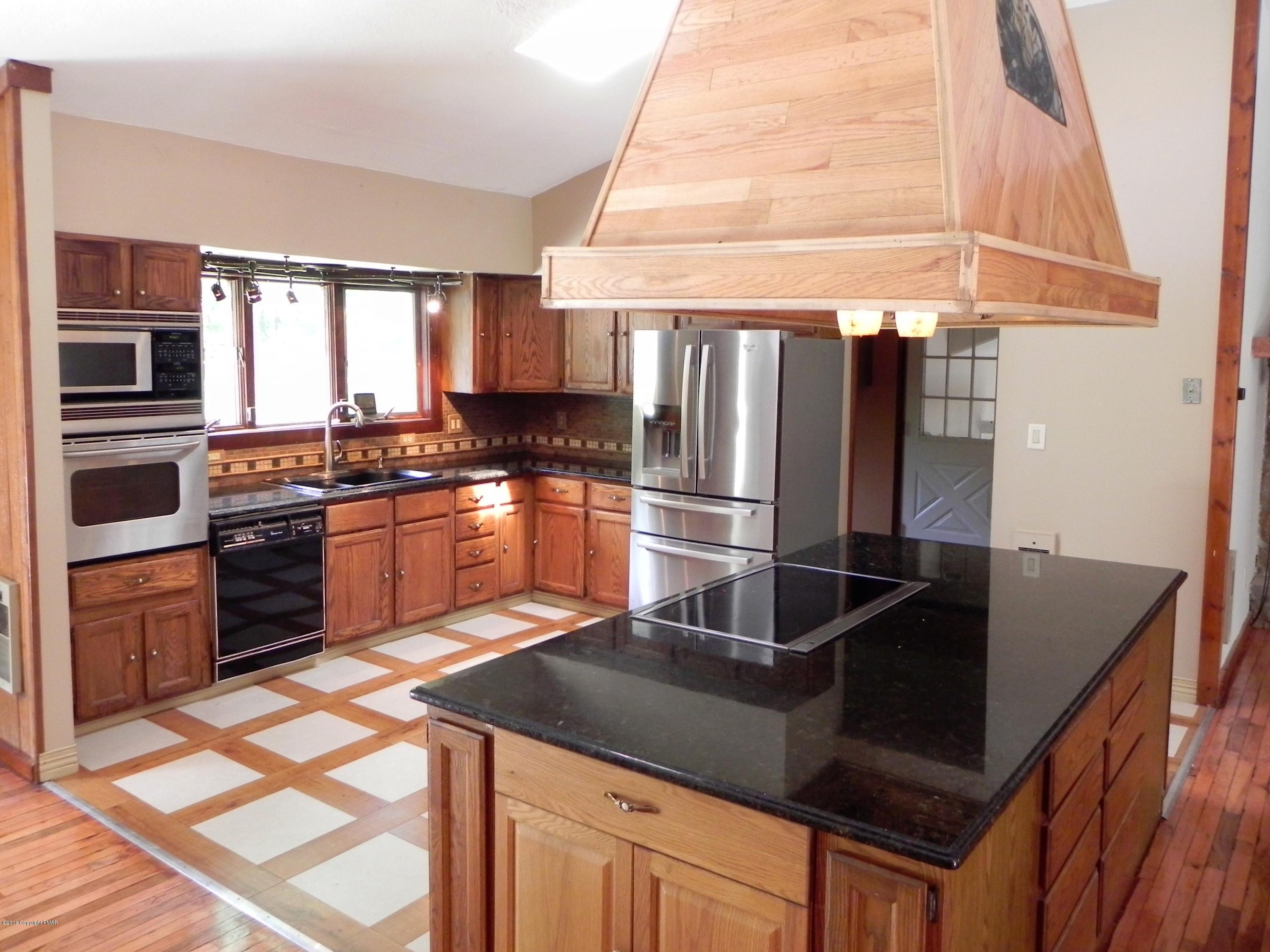 141 Rinker Road Stroudsburg, PA 18360 - Photo 3 of 29 a kitchen with stainless steel appliances granite countertop a sink stove and refrigerator