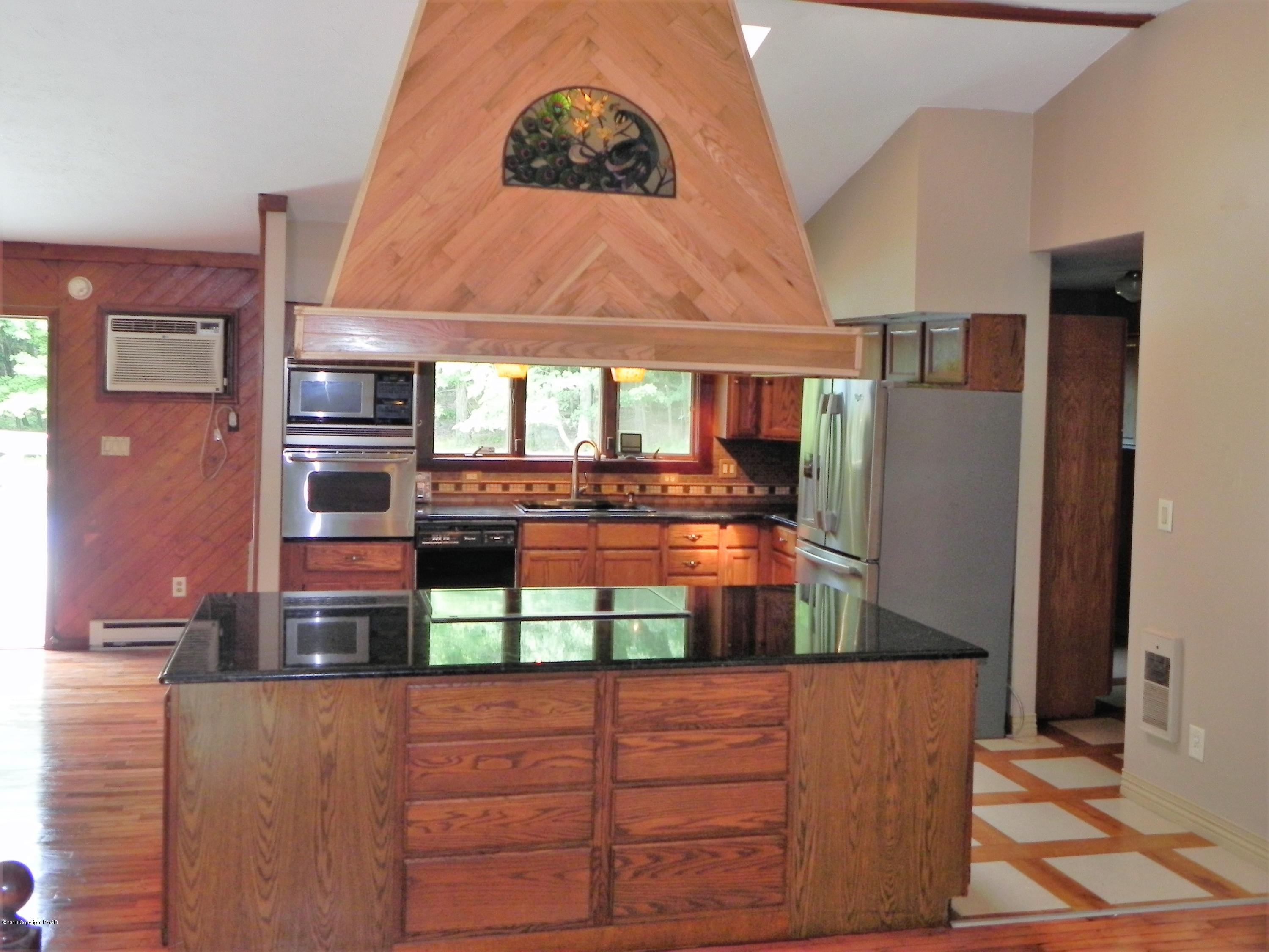 141 Rinker Road Stroudsburg, PA 18360 - Photo 4 of 29 a view of kitchen with stainless steel appliances granite countertop a stove and a refrigerator