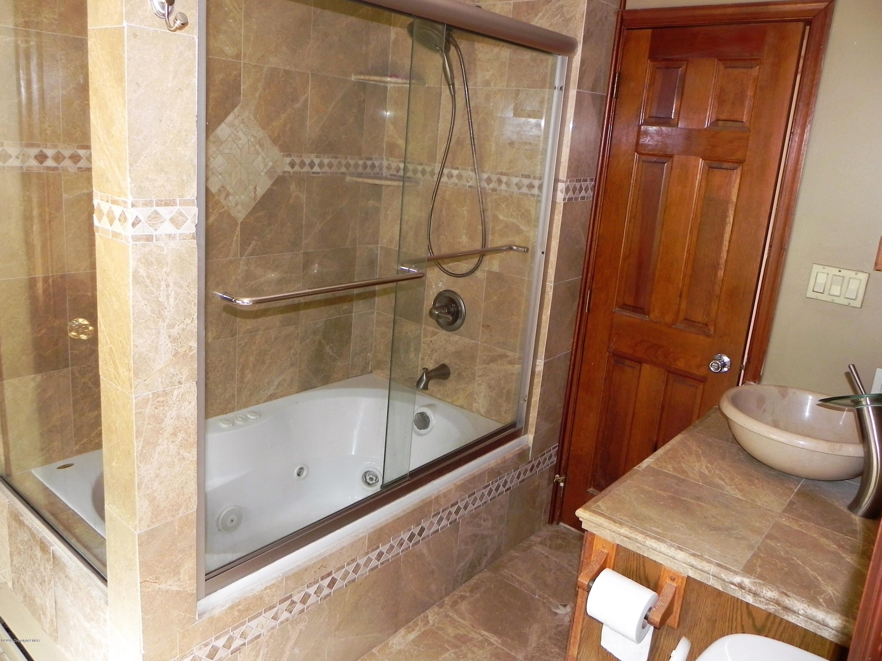 141 Rinker Road Stroudsburg, PA 18360 - Photo 8 of 29 a bathroom with a tub and shower