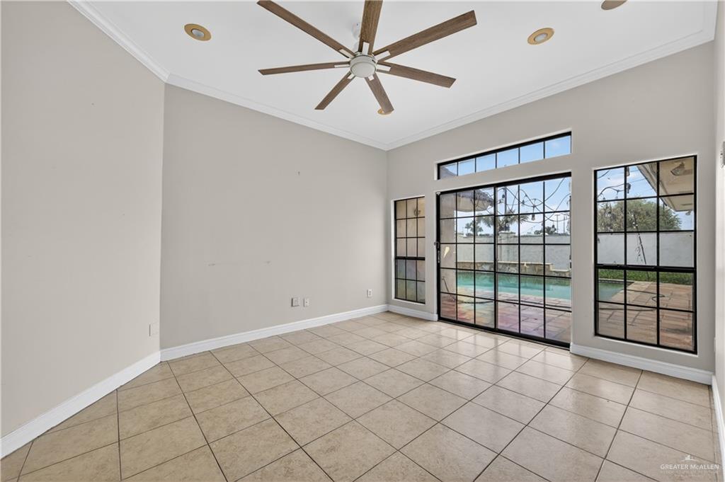 6004 North Cynthia Street McAllen, TX 78504 - Photo 14 of 25 Room featuring a vaulted ceiling with a wood-finish ceiling fan and recessed lighting