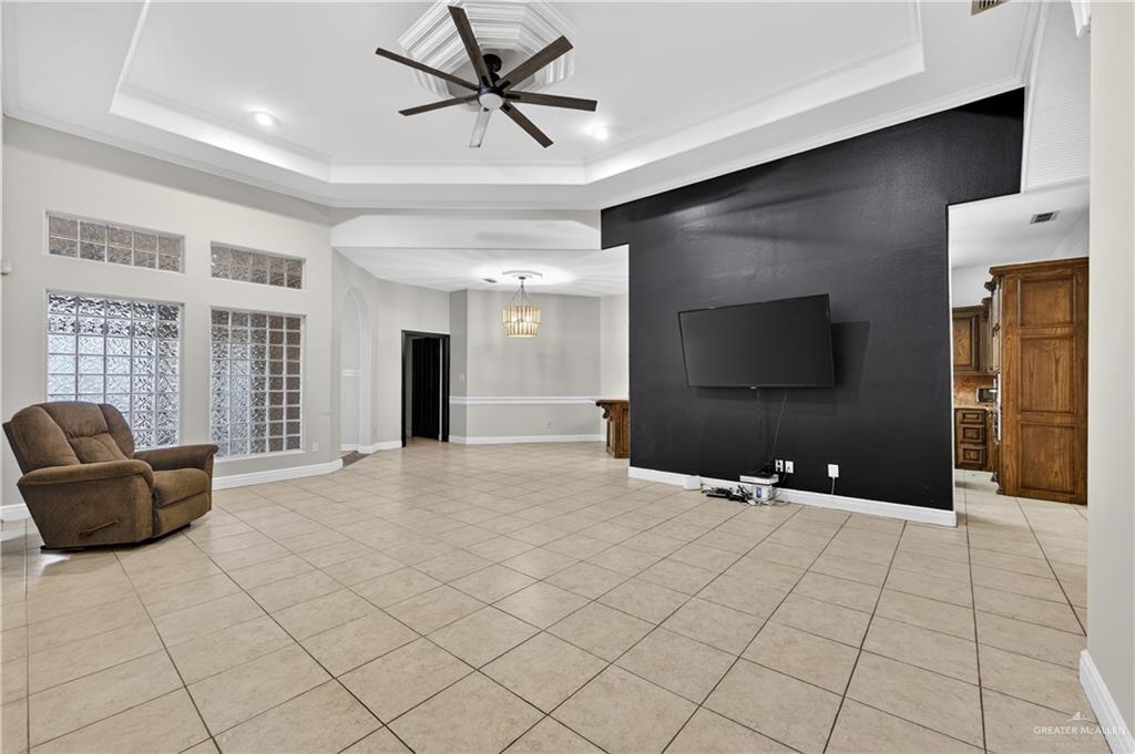 6004 North Cynthia Street McAllen, TX 78504 - Photo 22 of 25 Spacious room featuring light-toned square tile flooring throughout