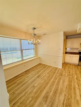 a view of a room with wooden floor and floors