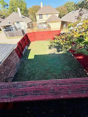 a view of a yard with an outdoor space
