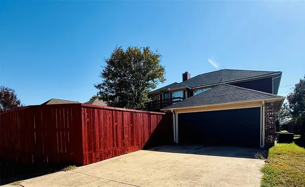 a front view of a house with a fence