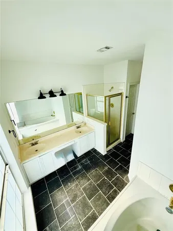 a bathroom with a sink and mirror
