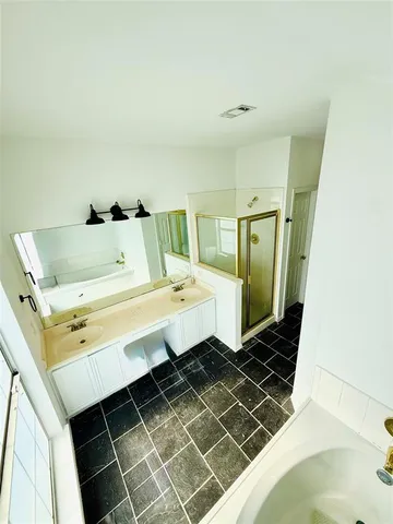 a bathroom with a sink and mirror