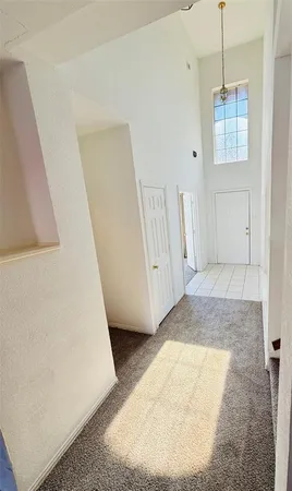 a view of a room with window and stairs