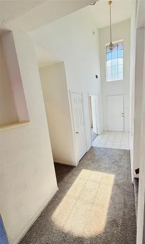 a view of a room with window and stairs