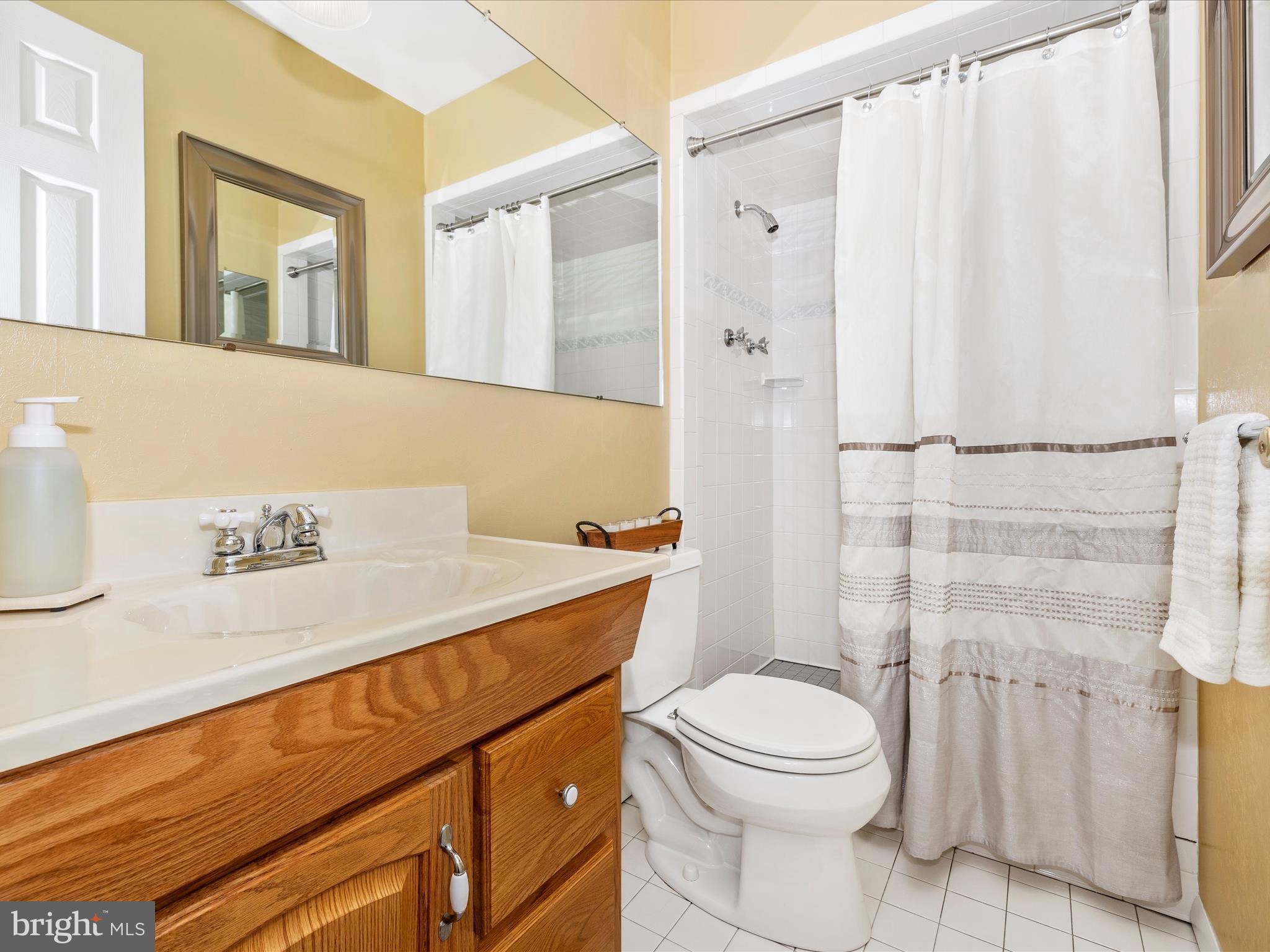 16 Kline Boulevard Frederick, MD 21701 - Photo 14 of 62 a bathroom with a sink a toilet and shower