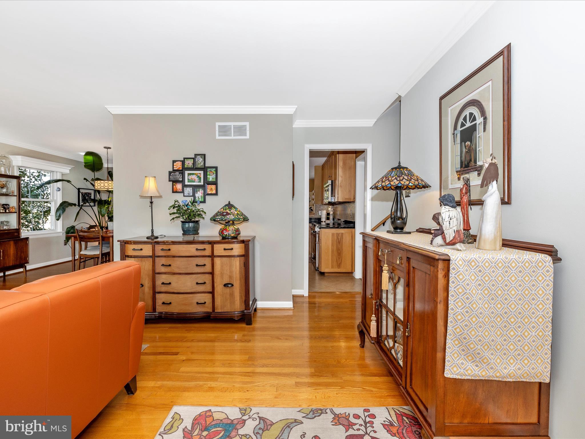 16 Kline Boulevard Frederick, MD 21701 - Photo 17 of 62 a room with furniture a flat screen tv and a refrigerator