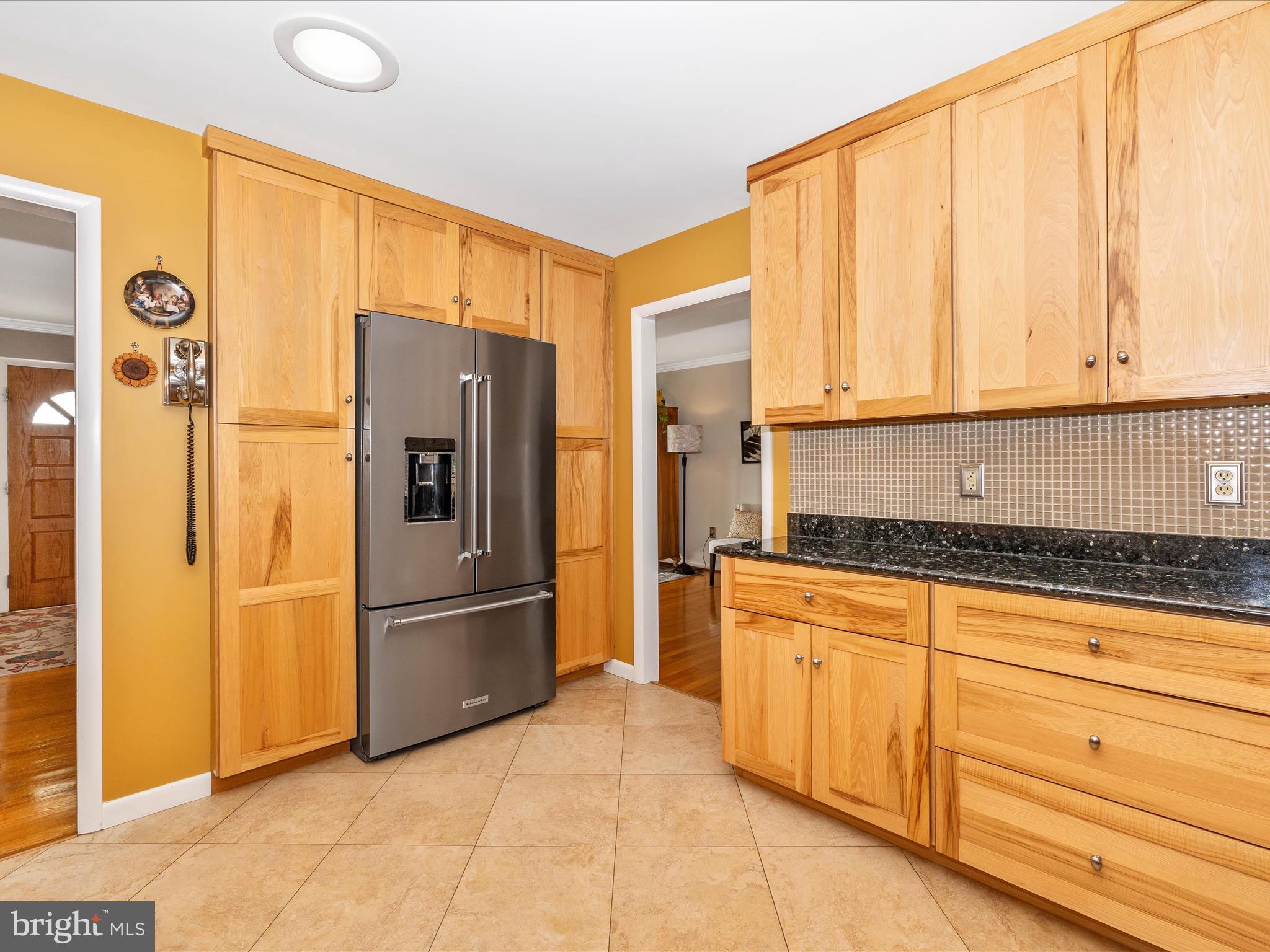 16 Kline Boulevard Frederick, MD 21701 - Photo 23 of 62 a kitchen with stainless steel appliances granite countertop a refrigerator sink and cabinets