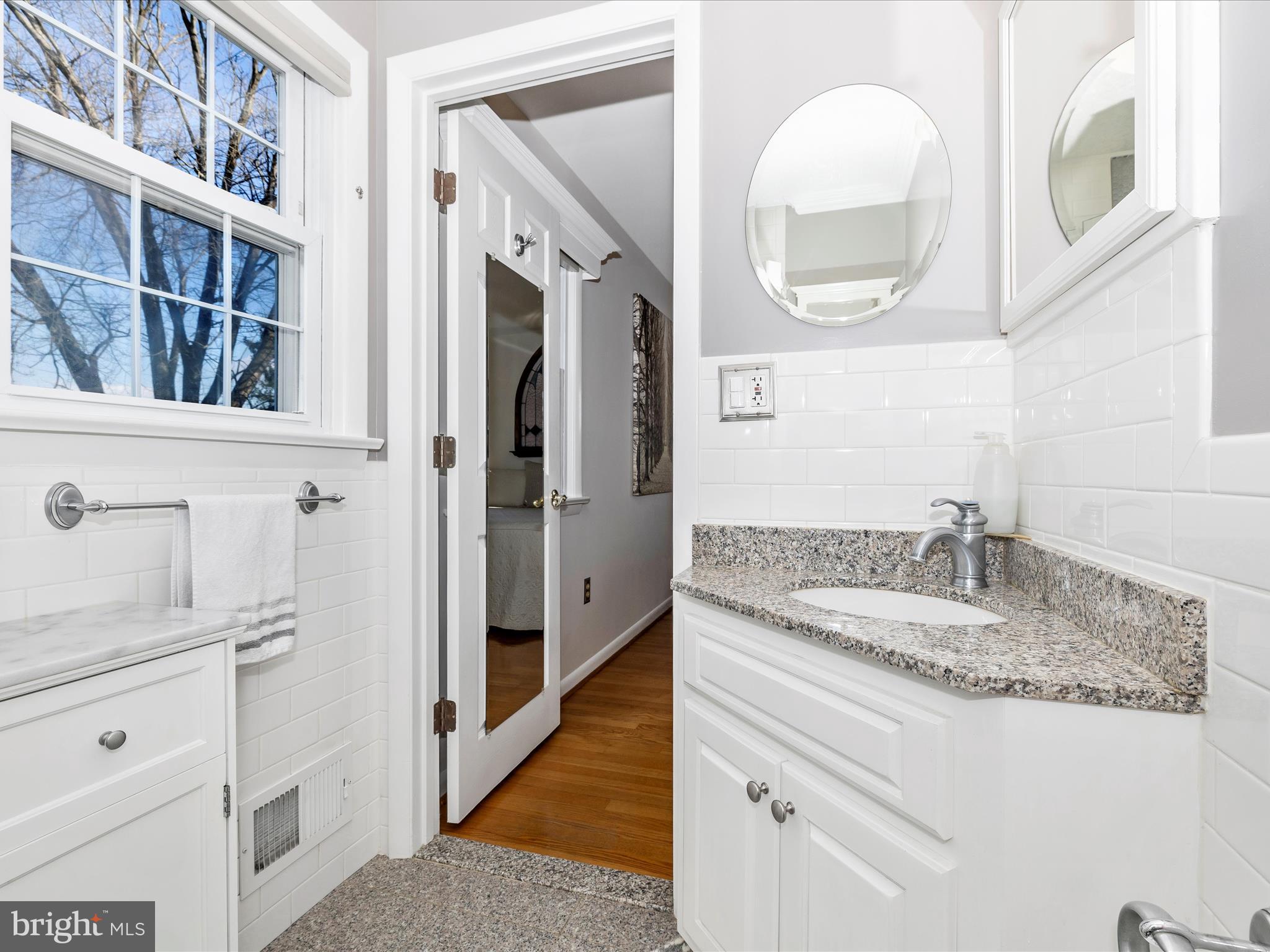 16 Kline Boulevard Frederick, MD 21701 - Photo 30 of 62 a bathroom with a granite countertop sink and a mirror