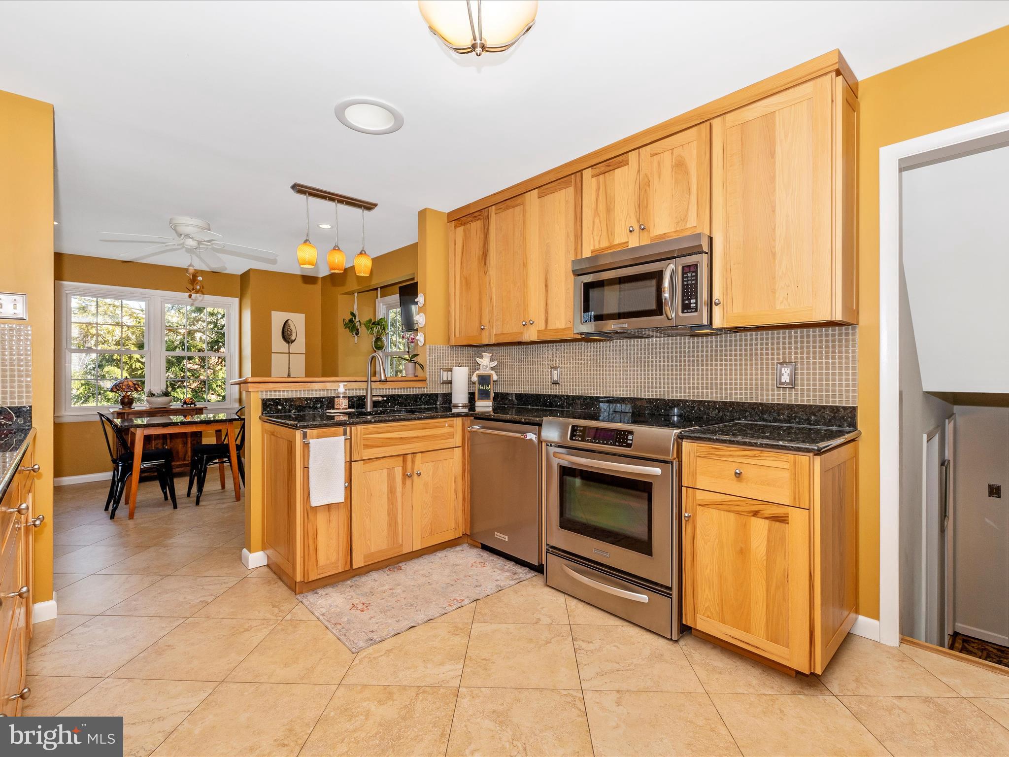 16 Kline Boulevard Frederick, MD 21701 - Photo 4 of 62 a kitchen with stainless steel appliances granite countertop a stove a sink and a microwave