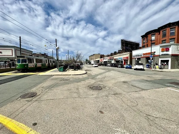 a view of a street with cars