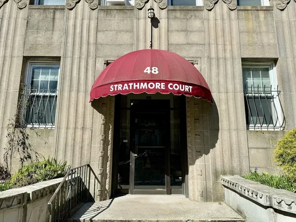 a view of a house with a door and a chair