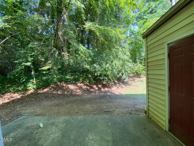 a view of a house with a tree