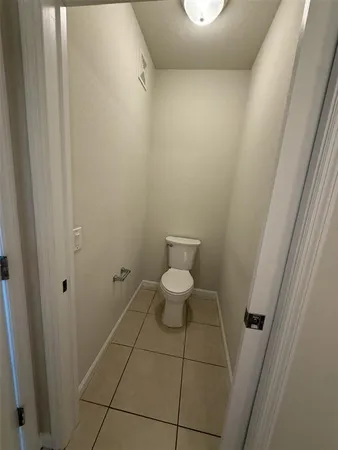 a bathroom with a sink a toilet a mirror and vanity