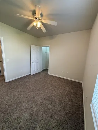 a utility room with cabinets washer and dryer