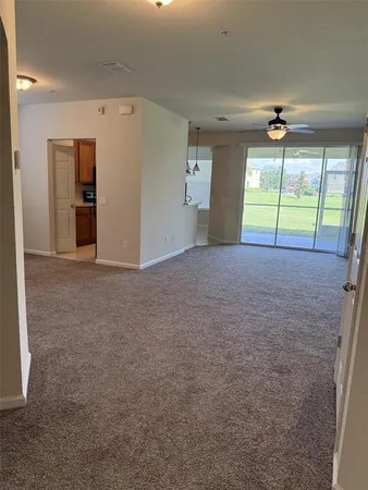 a kitchen with stainless steel appliances granite countertop a sink a stove and a wooden floors