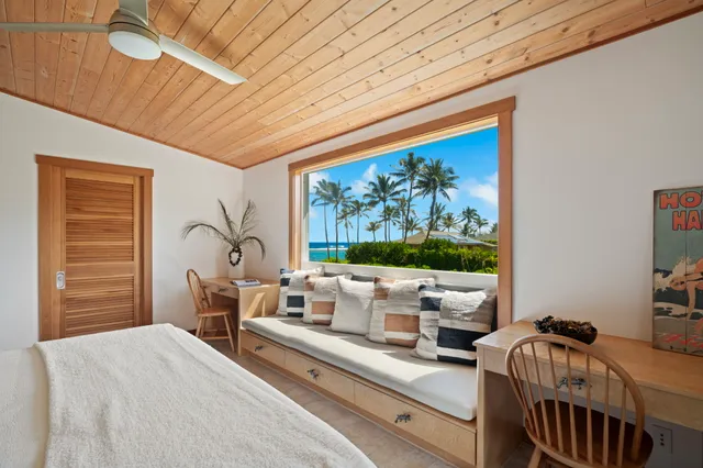 a bedroom with furniture and a window