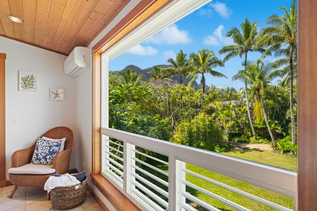 a view of a porch with furniture and a potted plant