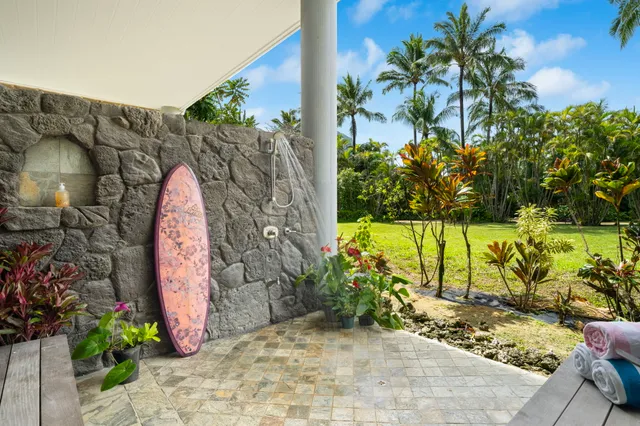 a view of a garden with a building in the background