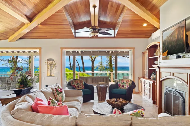 a living room with furniture fireplace and flat screen tv